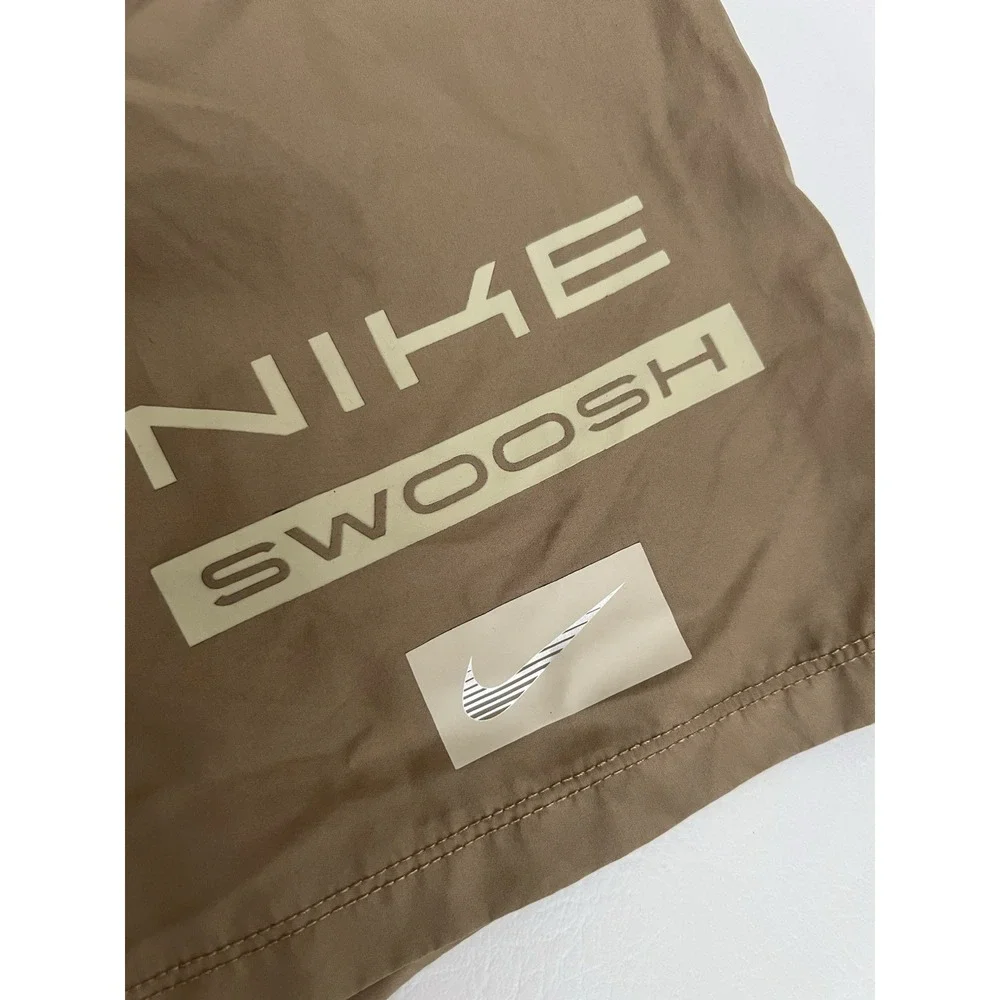 Nike Boys Size 6 Dri-FIT Parachute Khaki Swoosh Graphic Athletic Shorts Unlined